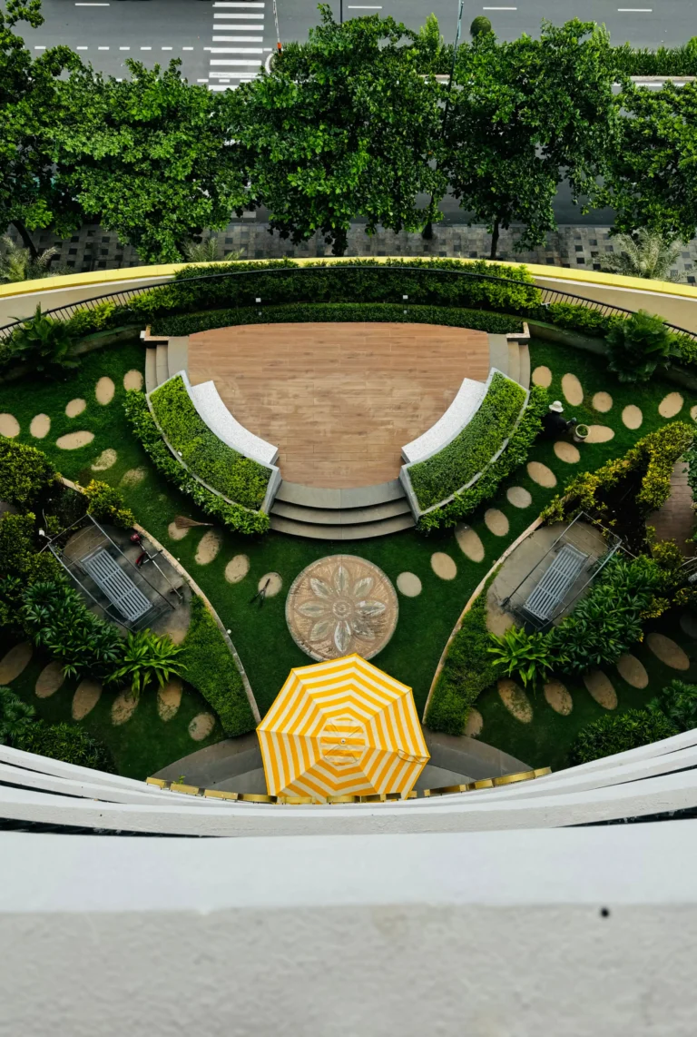 Small back garden divided into distinct seating and planting zones